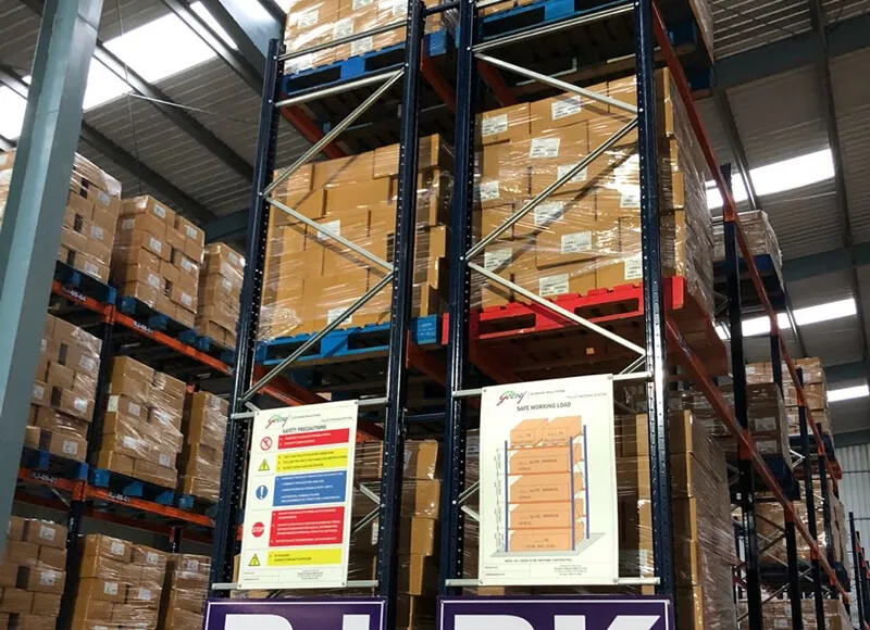 Pallet racking stacked with pharma cartons